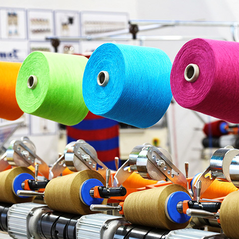 Textile yarn spools
